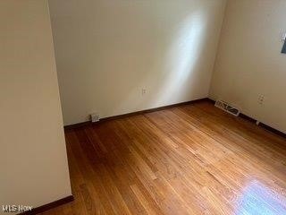 1531 E 290th St, Wickliffe, OH 44092 - empty room with wood finished floors
