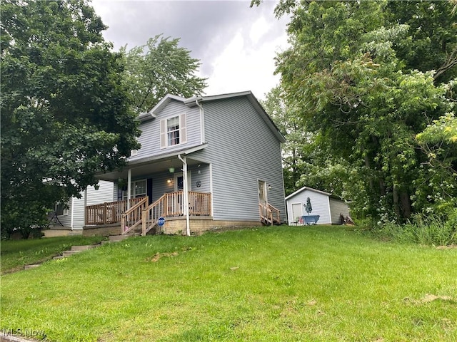 732 E High St, Alliance, OH 44601 - view of front of property featuring a porch, a front yard, and a storage unit