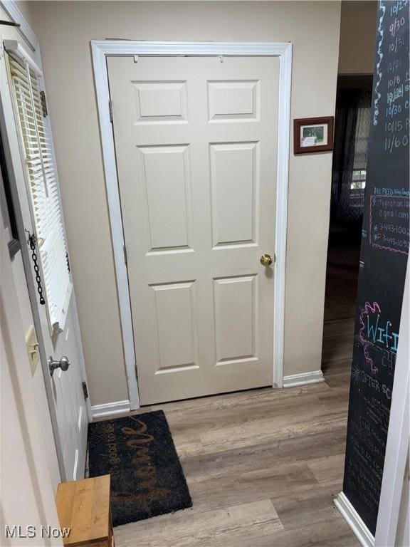 732 E High St, Alliance, OH 44601 - corridor featuring wood finished floors and baseboards