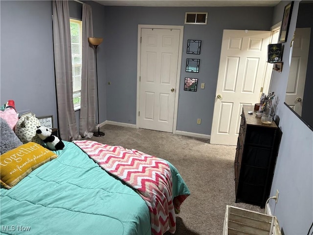 732 E High St, Alliance, OH 44601 - carpeted bedroom featuring baseboards