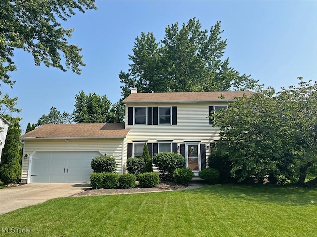 3061 Greenwich Ln, Brunswick, OH 44212 - colonial home with a garage, a chimney, concrete driveway, and a front lawn