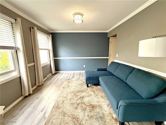3061 Greenwich Ln, Brunswick, OH 44212 - living area featuring wood finished floors, plenty of natural light, ornamental molding, and a textured ceiling