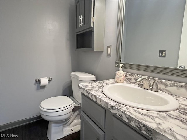 3061 Greenwich Ln, Brunswick, OH 44212 - half bathroom with vanity and wood finished floors