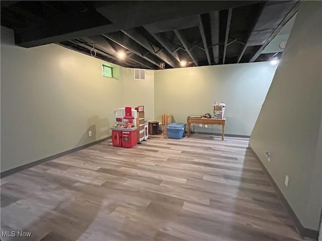 3061 Greenwich Ln, Brunswick, OH 44212 - below grade area featuring wood finished floors and baseboards