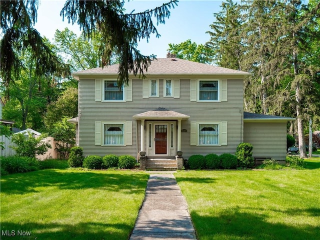 26269 Bagley Rd, Olmsted Falls, OH 44138 - view of front of property featuring a front yard, a chimney, and a shingled roof