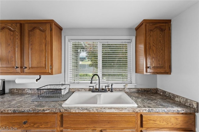 1309 7th St N, Martins Ferry, OH 43935 - kitchen with brown cabinetry and dark countertops