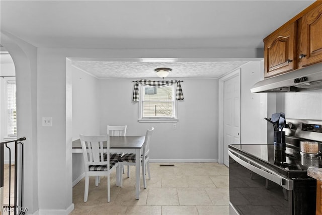 1309 7th St N, Martins Ferry, OH 43935 - dining room with arched walkways and light tile patterned flooring