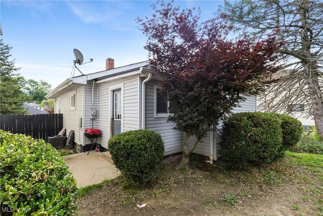1309 7th St N, Martins Ferry, OH 43935 - view of property exterior with a chimney and a cooling unit