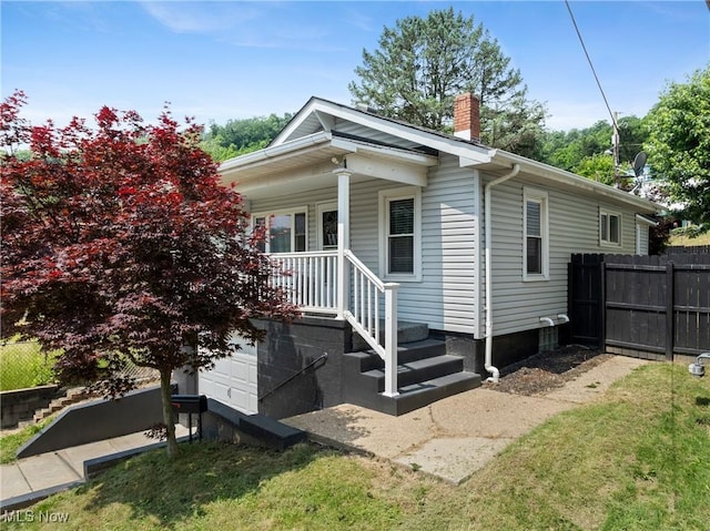 1309 7th St N, Martins Ferry, OH 43935 - view of home's exterior with a chimney and covered porch