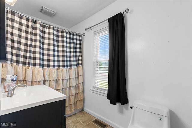 1309 7th St N, Martins Ferry, OH 43935 - bathroom featuring plenty of natural light and vanity