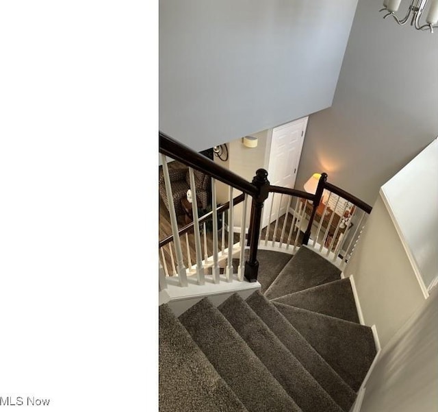 324 Buttermere Ln, Amherst, OH 44001 - stairs with a chandelier and carpet flooring