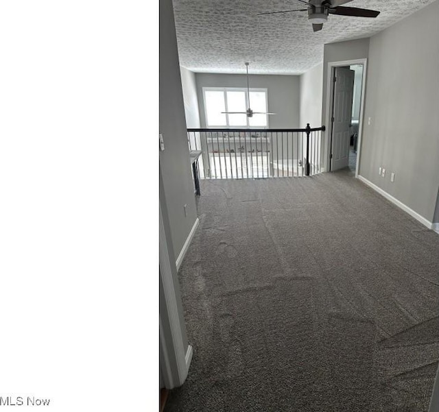 324 Buttermere Ln, Amherst, OH 44001 - spare room with a ceiling fan, a textured ceiling, and carpet