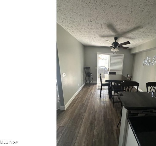 324 Buttermere Ln, Amherst, OH 44001 - dining room with dark wood-style floors, a ceiling fan, and a textured ceiling