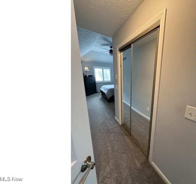 324 Buttermere Ln, Amherst, OH 44001 - corridor featuring a textured ceiling and carpet