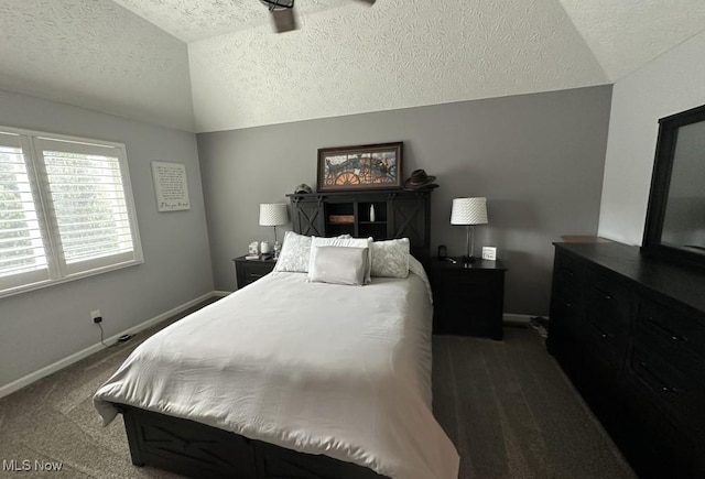 324 Buttermere Ln, Amherst, OH 44001 - bedroom featuring a textured ceiling, dark carpet, and vaulted ceiling