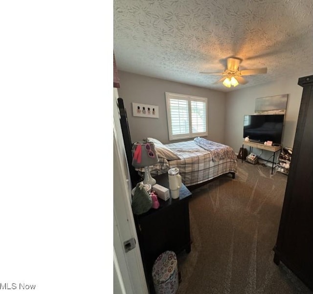 324 Buttermere Ln, Amherst, OH 44001 - bedroom featuring a textured ceiling, carpet floors, and a ceiling fan
