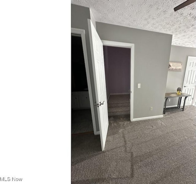 324 Buttermere Ln, Amherst, OH 44001 - unfurnished bedroom featuring carpet flooring and a textured ceiling