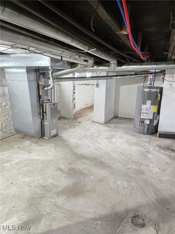 4175 E 95th St, Cleveland, OH 44105 - unfinished basement featuring gas water heater and heating unit