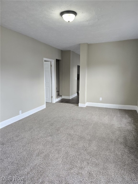 4175 E 95th St, Cleveland, OH 44105 - empty room featuring carpet flooring and a textured ceiling