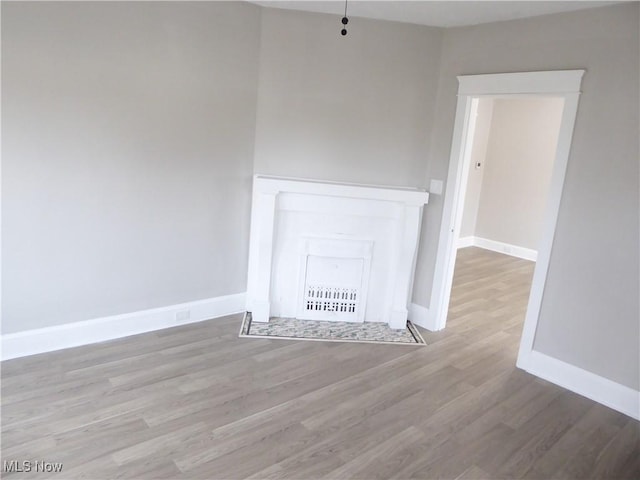 2032 W 98th St, Cleveland, OH 44102 - empty room with wood finished floors and baseboards