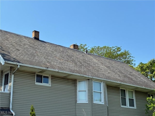 2032 W 98th St, Cleveland, OH 44102 - exterior view of gutters, a downspout, and a chimney