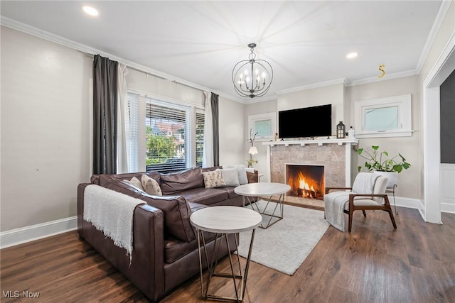 1646 Wyandotte Ave, Lakewood, OH 44107 - living area with a fireplace with flush hearth, crown molding, dark wood-style flooring, recessed lighting, and a chandelier