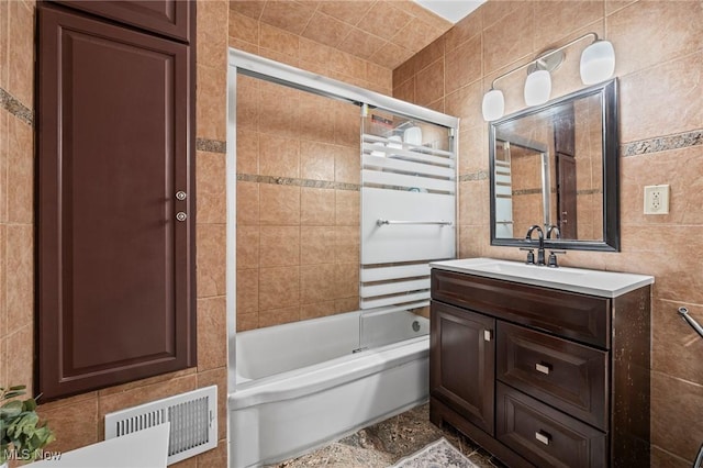 1646 Wyandotte Ave, Lakewood, OH 44107 - full bathroom featuring tile walls, shower / bath combination with glass door, and vanity