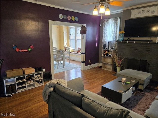 1038 Quincy St, Parkersburg, WV 26101 - living room with wood finished floors, ceiling fan, crown molding, and healthy amount of natural light