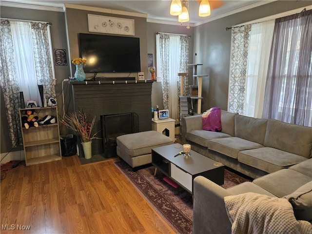 1038 Quincy St, Parkersburg, WV 26101 - living area featuring crown molding, wood finished floors, ceiling fan, and a fireplace