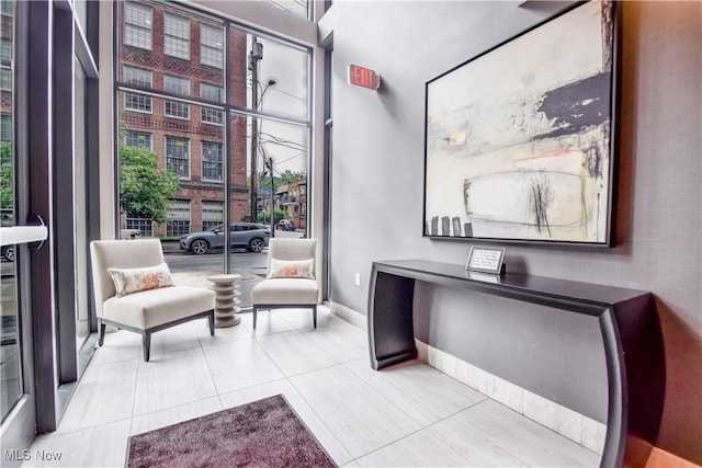 2044 Random Rd Unit 303, Cleveland, OH 44106 - living area featuring tile patterned floors and baseboards