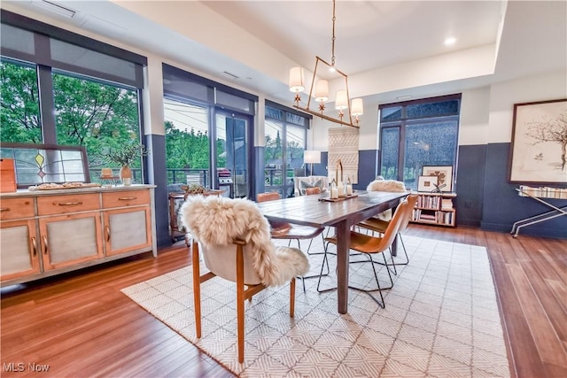 2044 Random Rd Unit 303, Cleveland, OH 44106 - dining room with wood finished floors, a chandelier, and recessed lighting