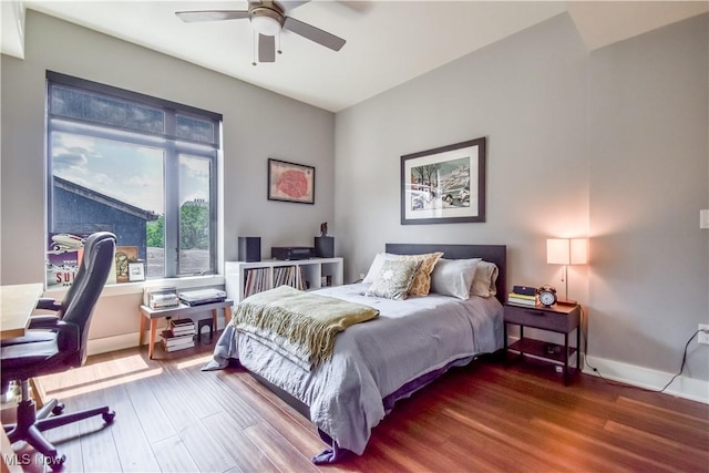 2044 Random Rd Unit 303, Cleveland, OH 44106 - bedroom with wood finished floors, an office area, and a ceiling fan