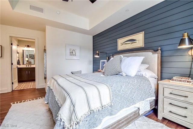 2044 Random Rd Unit 303, Cleveland, OH 44106 - bedroom featuring wood finished floors, wood walls, and ensuite bathroom