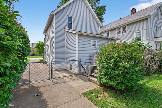 2117 Woodward Ave, Lakewood, OH 44107 - rear view of house featuring a gate