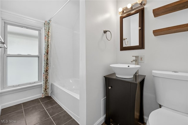2117 Woodward Ave, Lakewood, OH 44107 - full bath with plenty of natural light, vanity, shower / bathtub combination with curtain, and tile patterned floors