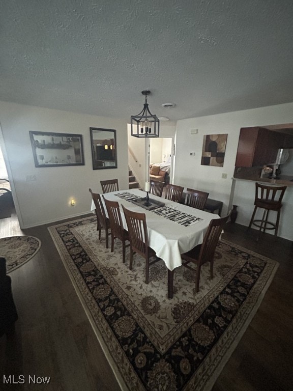 8050 Harbor Creek Dr Unit 1903, Mentor-On-The-Lake, OH 44060 - dining space with a chandelier, wood finished floors, and a textured ceiling