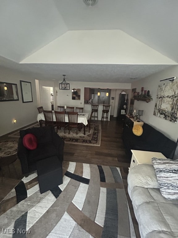 8050 Harbor Creek Dr Unit 1903, Mentor-On-The-Lake, OH 44060 - living room featuring vaulted ceiling and wood finished floors
