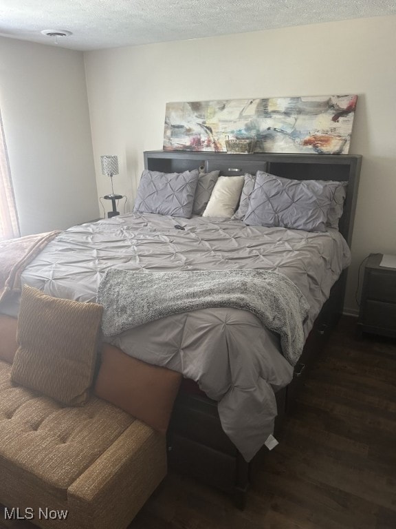 8050 Harbor Creek Dr Unit 1903, Mentor-On-The-Lake, OH 44060 - bedroom featuring wood finished floors and a textured ceiling