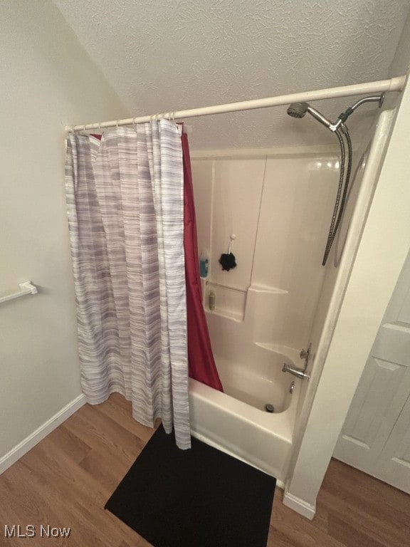 8050 Harbor Creek Dr Unit 1903, Mentor-On-The-Lake, OH 44060 - full bathroom featuring shower / bath combo, wood finished floors, and a textured ceiling