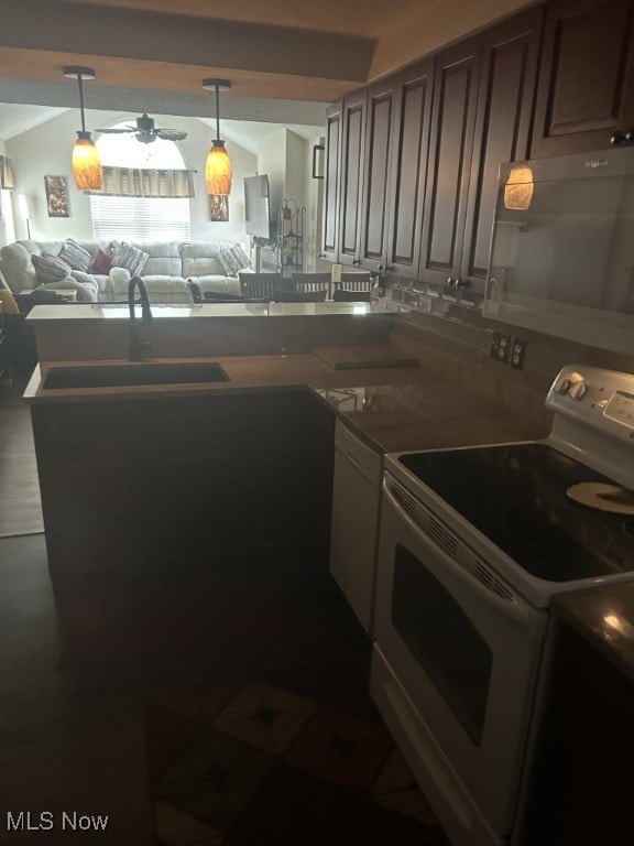 8050 Harbor Creek Dr Unit 1903, Mentor-On-The-Lake, OH 44060 - kitchen with electric stove, black microwave, open floor plan, a peninsula, and tasteful backsplash