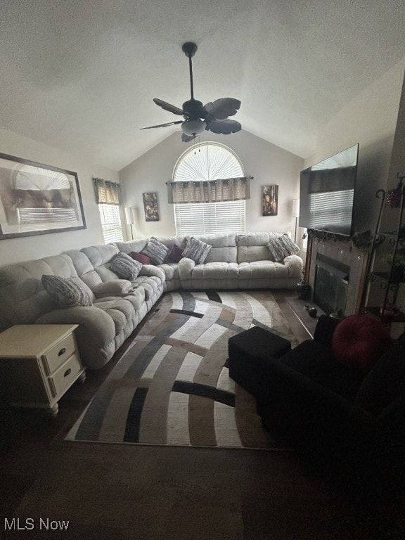 8050 Harbor Creek Dr Unit 1903, Mentor-On-The-Lake, OH 44060 - living room with a ceiling fan, plenty of natural light, vaulted ceiling, and a glass covered fireplace