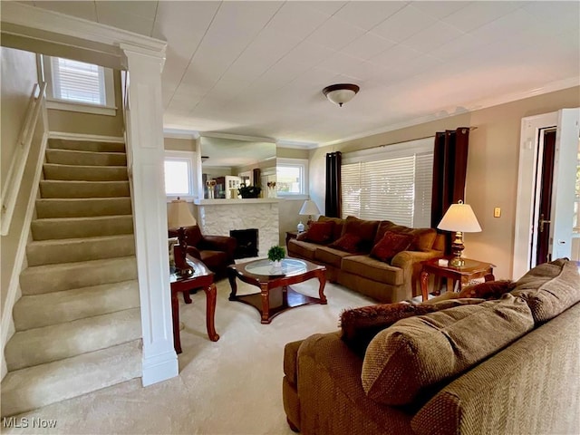 904 Chalker St, Akron, OH 44310 - living area with stairs, carpet, ornamental molding, plenty of natural light, and a fireplace