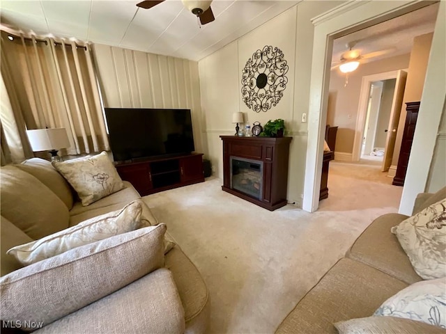 904 Chalker St, Akron, OH 44310 - carpeted living room featuring ceiling fan and a glass covered fireplace