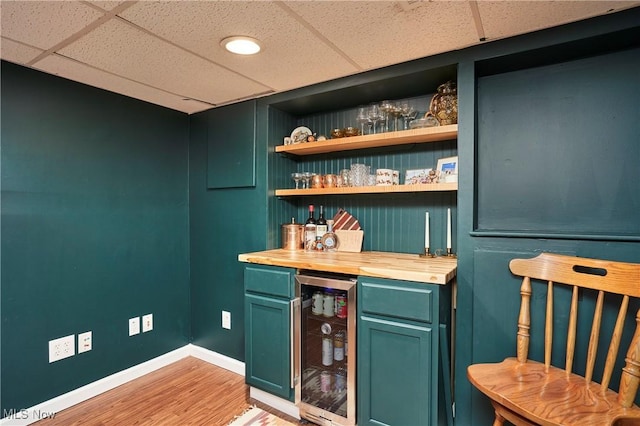 236 Johnson Ave, Cuyahoga Falls, OH 44221 - indoor dry bar featuring wine cooler, a paneled ceiling, and light wood finished floors