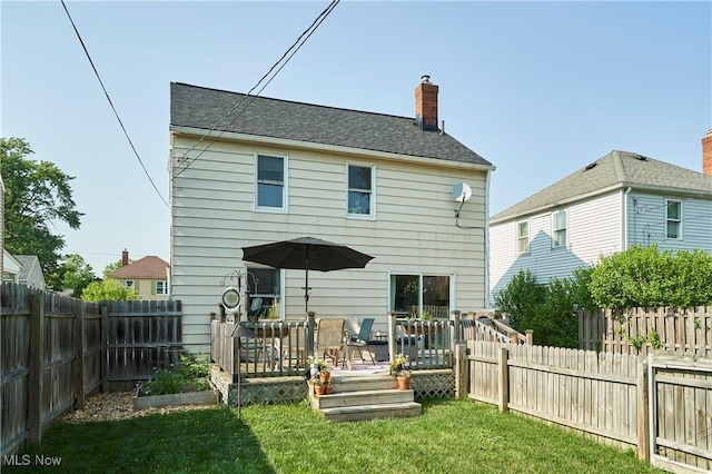 236 Johnson Ave, Cuyahoga Falls, OH 44221 - rear view of property featuring a wooden deck, a chimney, and a fenced backyard