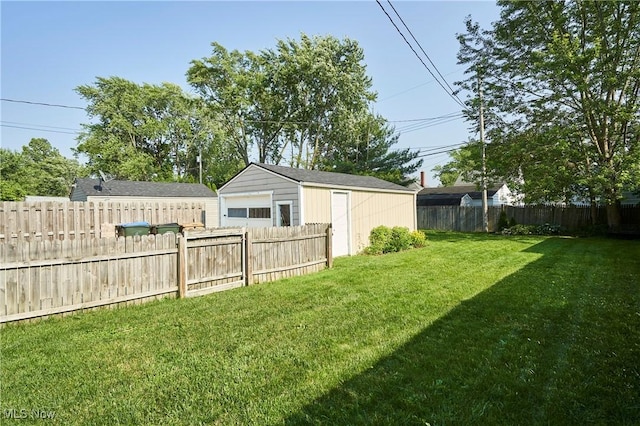 236 Johnson Ave, Cuyahoga Falls, OH 44221 - fenced backyard featuring a detached garage and an outdoor structure