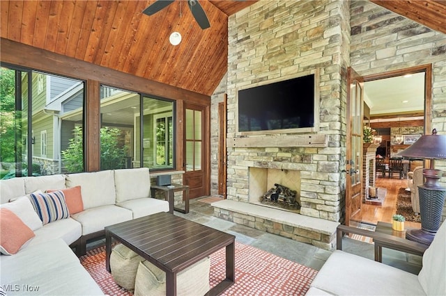 3116 Aviemore Way, Richfield, OH 44286 - living area with a ceiling fan, wood ceiling, an outdoor stone fireplace, high vaulted ceiling, and stone finish flooring