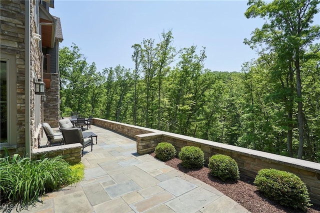 3116 Aviemore Way, Richfield, OH 44286 - view of patio with a forest view