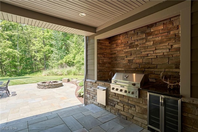 3116 Aviemore Way, Richfield, OH 44286 - view of patio / terrace featuring a fire pit, beverage cooler, and area for grilling