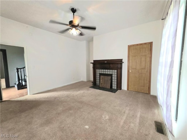 10 Browns Ridge Rd, Rockport, WV 26169 - unfurnished living room featuring carpet flooring, a ceiling fan, and a tile fireplace